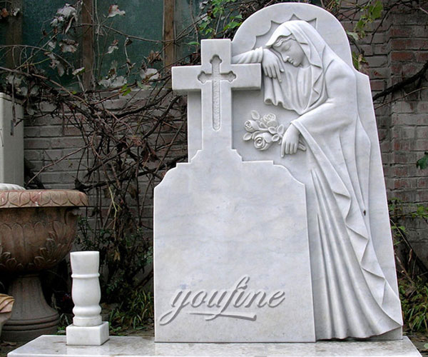 Religious monuments with virgin mary relief decoration