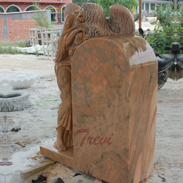 large angel sculptures upright headstones