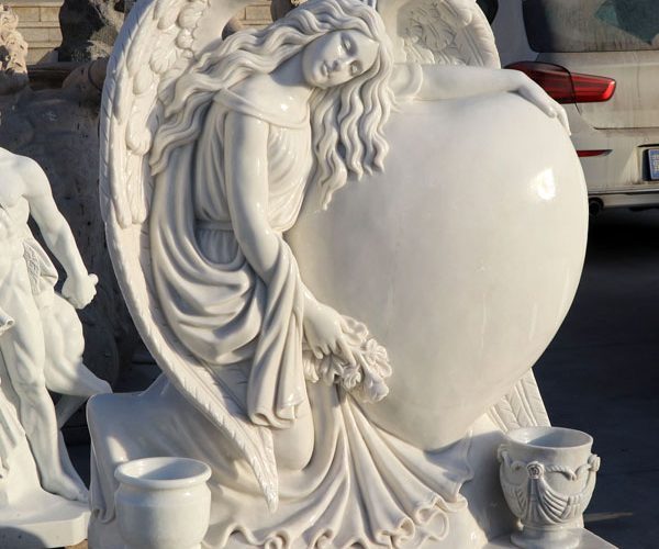 White stone preying baby angel grave markers costs